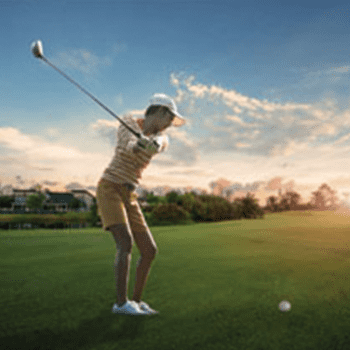 A person swinging a golf club